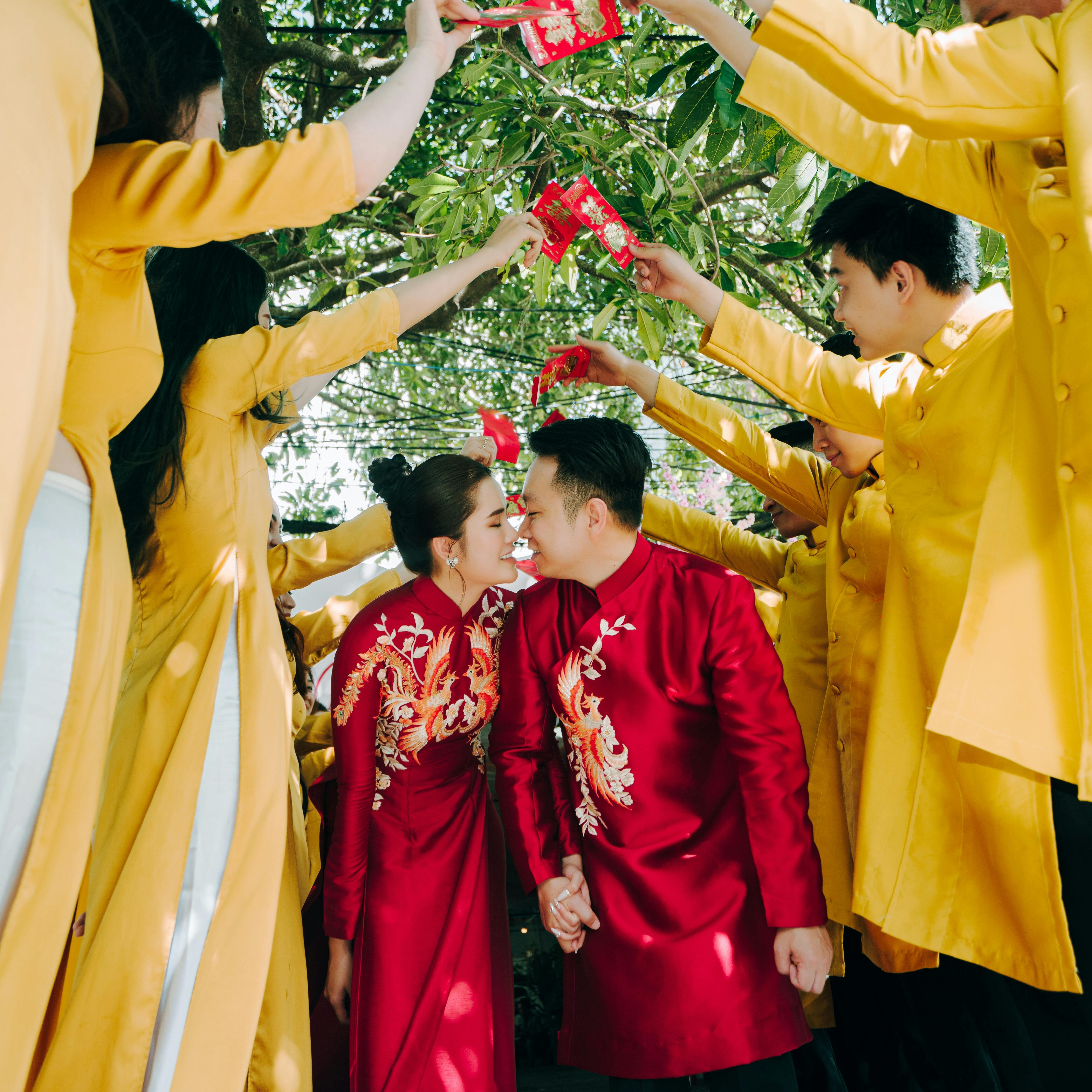 wedding-couple-wearing-traditional-red-clothing-row-guests-dressed-yellow-stock-photo